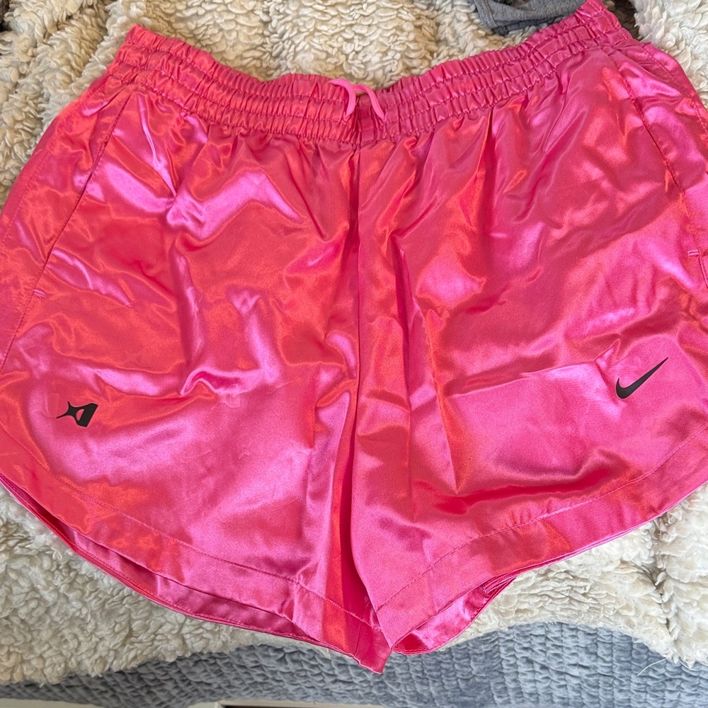 Pink satin Nike shorts.
Never worn
Size med
